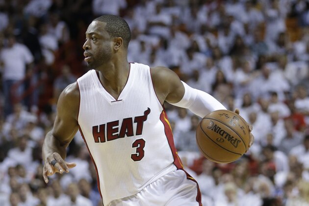 Miami Heat guard Dwyane Wade (3) takes the ball up court during the second half of Game 4 of an NBA second-round playoff basketball series against the Toronto Raptors, , Monday, May 9, 2016, in Miami. (AP Photo/Alan Diaz)