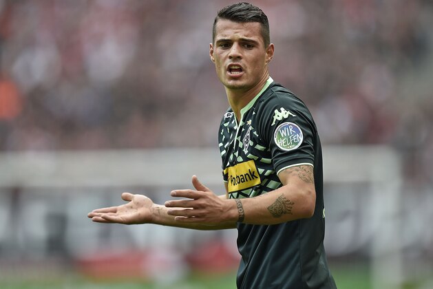 Moenchengladbach's Granit Xhaka gestures during the German Bundesliga soccer match between 1. FC Cologne and Borussia Moenchengladbach in Cologne, Germany, Saturday, Sept. 19, 2015. (AP Photo/Martin Meissner) Moenchengladbach's Granit Xhaka gestures during the German Bundesliga soccer match between 1. FC Cologne and Borussia Moenchengladbach in Cologne, Germany, Saturday, Sept. 19, 2015. (AP Photo/Martin Meissner)