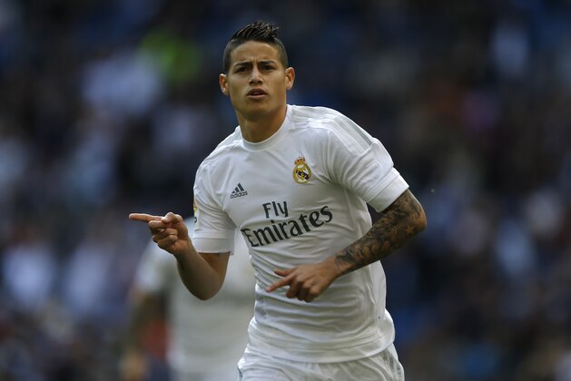 Real Madrid's James Rodriguez celebrates after scoring the opening goal against Eibar during the Spanish La Liga soccer match between Real Madrid and Eibar at the Santiago Bernabeu stadium in Madrid, Saturday, April 9, 2016. (AP Photo/Francisco Seco)