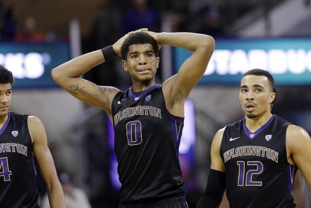 Washington's Matisse Thybulle (4), Marquese Chriss (0) and Andrew Andrews (12) react to a call in California's favor late in the second half of an NCAA college basketball game Thursday, Feb. 18, 2016, in Seattle. California won 78-75. (AP Photo/Elaine Thompson)
