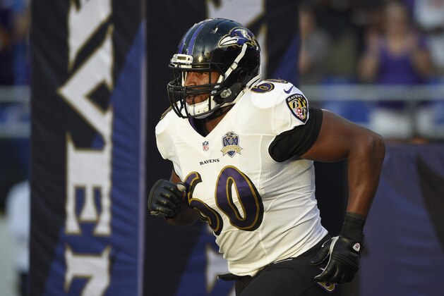 Baltimore Ravens tackle Eugene Monroe (60) runs onto the field before an NFL preseason football game against the New Orleans Saints, Thursday, Aug. 13, 2015, in Baltimore. (AP Photo/Nick Wass)
