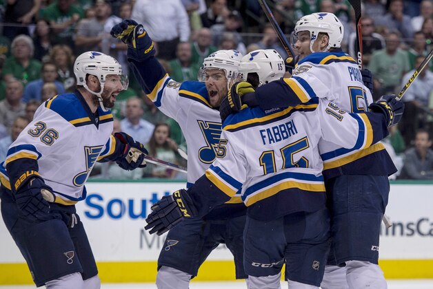 May 11, 2016; Dallas, TX, USA; St. Louis Blues center Robby Fabbri (15) celebrates with right wing Troy Brouwer (36), center Paul Stastny (26), and defenseman Colton Parayko (55) after scoring a goal against the Dallas Stars during the first period in game seven of the second round of the 2016 Stanley Cup Playoffs at American Airlines Center. Mandatory Credit: Jerome Miron-USA TODAY Sports