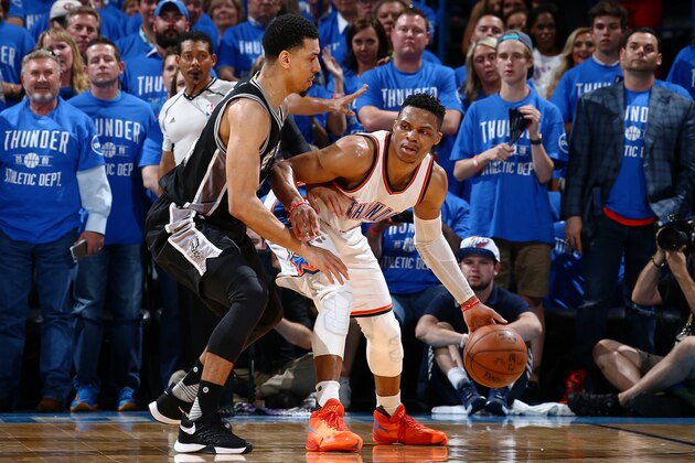 OKLAHOMA CITY, OK- MAY 12:  Russell Westbrook #0 of the Oklahoma City Thunder posts up against Danny Green #14 of the San Antonio Spurs in Game Six of the Western Conference Semifinals during the 2016 NBA Playoffs on May 12, 2016 at Chesapeake Energy Arena in Oklahoma City, Oklahoma. NOTE TO USER: User expressly acknowledges and agrees that, by downloading and or using this photograph, User is consenting to the terms and conditions of the Getty Images License Agreement. Mandatory Copyright Notice: Copyright 2016 NBAE (Photo by Nathaniel S. Butler/NBAE via Getty Images)