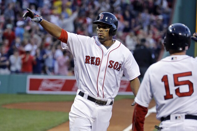 Boston Red Sox's Xander Bogaerts points to the fans as he crosses the plate after hitting a 2-run homer driving in Dustin Pedroia (15) in the first inning of a baseball game against the Houston Astros at Fenway Park, Thursday, May 12, 2016, in Boston. (AP Photo/Elise Amendola)