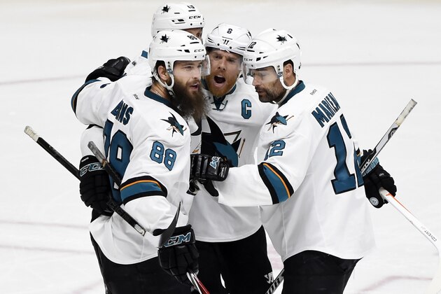 San Jose Sharks' Brent Burns (88) celebrates with Joe Pavelski (8) and Patrick Marleau (12) after scoring a goal against the Nashville Predators during the third period in Game 4 of an NHL hockey Stanley Cup Western Conference semifinal playoff series Thursday, May 5, 2016, in Nashville, Tenn. (AP Photo/Mark Zaleski)