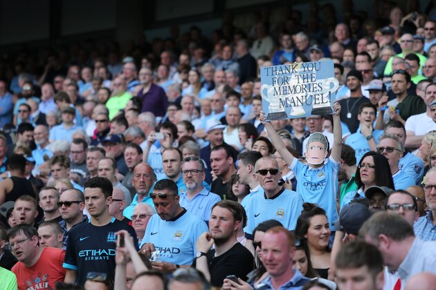 MANCHESTER, ENGLAND - MAY 08:  A fan holds up a banner celebrating Manuel Pellegrini the head coach / manager of Manchester City during the Barclays Premier League match between Manchester City and Arsenal at the Ethiad Stadium on May 1, 2016 in Manchester, United Kingdom. (Photo by Matthew Ashton - AMA/Getty Images)