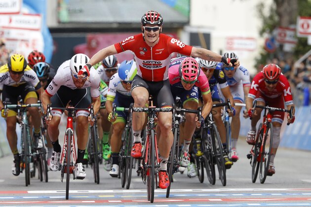 German cyclist Andre Greipel (C) raises his arms in victory as he crosses the finish line of the Giro d'Italia (tour of Italy) 7th stage, in Foligno, on May 13, 2016.  / AFP / LUK BENIES        (Photo credit should read LUK BENIES/AFP/Getty Images)