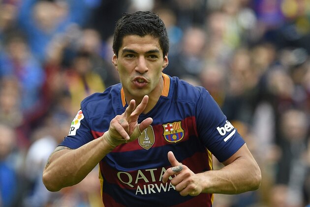 Barcelona's Uruguayan forward Luis Suarez celebrates after scoring a goal during the Spanish league football match FC Barcelona vs RCD Espanyol at the Camp Nou stadium in Barcelona on May 8, 2016. / AFP / LLUIS GENE        (Photo credit should read LLUIS GENE/AFP/Getty Images)