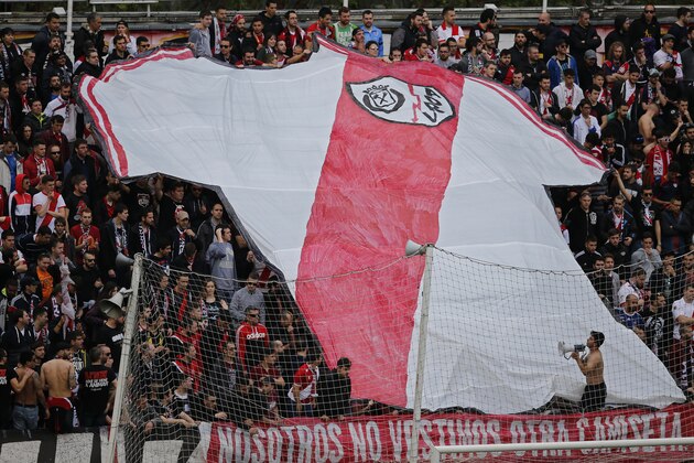 Rayo Vallecano fans display a giant team shirt before the start of  a Spanish La Liga soccer match between Rayo Vallecano and Real Madrid at the Vallecas stadium in Madrid, Spain, Saturday April 23, 2016. (AP Photo/Paul White)
