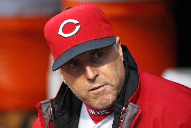 Cincinnati Reds manager Bryan Price stands in the dugout before a baseball game against the Pittsburgh Pirates in Pittsburgh, Friday, April 29, 2016. (AP Photo/Gene J. Puskar)