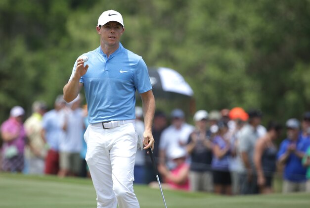 Rory McIlroy of Northern Ireland, shows his ball after making a birdie putt on the seventh hole during the second round of The Players Championship golf tournament Friday, May 13, 2016, in Ponte Vedra Beach, Fla. (AP Photo/Lynne Sladky)