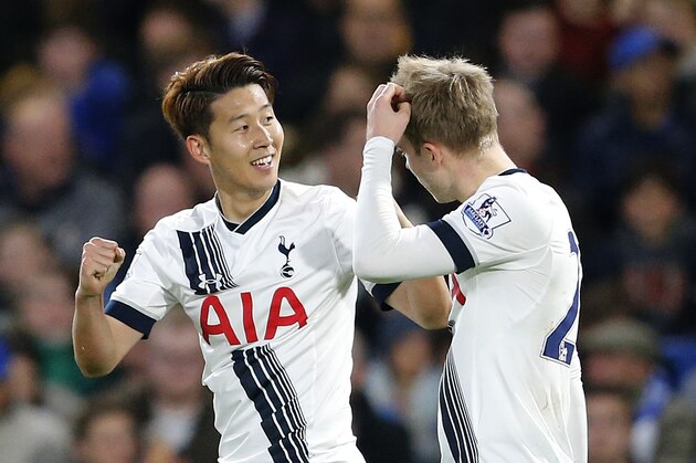Tottenham's Son Heung-min, left, celebrates with Christian Eriksen after he scores a goal during the English Premier League soccer match between Chelsea and Tottenham Hotspur at Stamford Bridge stadium in London, Monday, May 2, 2016. (AP Photo/Frank Augstein)