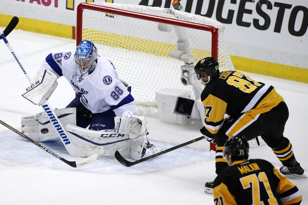 Tampa Bay Lightning goalie Andrei Vasilevskiy (88) stops a shot by Pittsburgh Penguins' Sidney Crosby (87) during the third period of Game 1 of the NHL hockey Stanley Cup Eastern Conference finals Friday, May 13, 2016, in Pittsburgh. The Lightning won 3-1. (AP Photo/Gene J. Puskar)