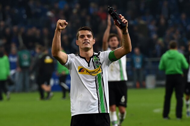 Moenchengladbach's Swiss midfielder Granit Xhaka reacts after the German Cup DFB second round football match Schalke 04 vs Borussia Moenchengladbach in Gelsenkirchen, western Germany on October 28, 2015. AFP PHOTO / PATRIK STOLLARZ

RESTRICTIONS / EMBARGO  ACCORDING TO DFB RULES IMAGE SEQUENCES TO SIMULATE VIDEO IS NOT ALLOWED DURING MATCH TIME. MOBILE (MMS) USE IS NOT ALLOWED DURING AND FOR FURTHER TWO HOURS AFTER THE MATCH. FOR MORE INFORMATION CONTACT DFB DIRECTLY AT +49 69 67880.        (Photo credit should read PATRIK STOLLARZ/AFP/Getty Images)