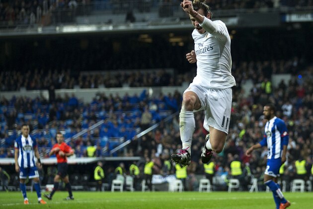 Real Madrid's Welsh forward Gareth Bale celebrates a goal during the Spanish league football match Real Madrid CF vs RC Deportivo de la Coruna at the Santiago Bernabeu stadium in Madrid on January 9, 2016.   AFP PHOTO / GONZALO ARROYO / AFP / GONZALO ARROYO        (Photo credit should read GONZALO ARROYO/AFP/Getty Images)