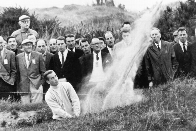 Dave Marr, New Rochelle, N.Y. blasts from bunker approaching first green in second day of play in the Ryder Golf on Oct. 8, 1965 at Southport, England. Marr and his partner Arnold Palmer, defeated their British opponents, Peter Allis and Christy O'Connor, 6 and 4. (AP Photo)