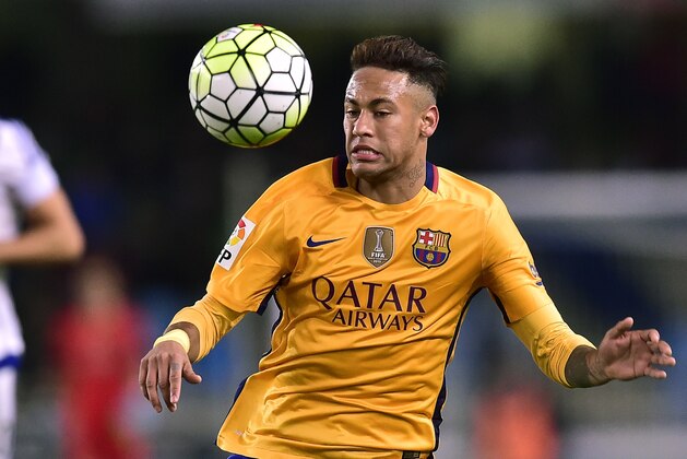 Barcelona's Neymar of Brazil, goes for the ball during their Spanish La Liga soccer match between Barcelona and Real Sociedad, at Anoeta stadium in San Sebastian, northern Spain, Saturday, April 9, 2016.  Barcelona lost the match 1-0. (AP Photo/Alvaro Barrientos)