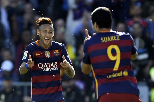Barcelona's Uruguayan forward Luis Suarez (R) celebrates with Barcelona's Brazilian forward Neymar after scoring during the Spanish league football match Granada CF vs FC Barcelona at Nuevo Los Carmenes stadium in Granada on May 14, 2016.
Barcelona sealed their 24th La Liga title as Luis Suarez took his tally for the season to 59 goals with a hat-trick in a 3-0 win at Granada to hold off Real Madrid's late-season surge. / AFP / CRISTINA QUICLER        (Photo credit should read CRISTINA QUICLER/AFP/Getty Images)