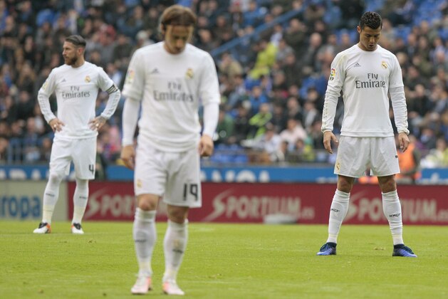 Real Madrid's Cristiano Ronaldo, right, Luca Modric, center, and Sergio Ramos wait for play to restart during a Spanish La Liga soccer match between Deportivo and Real Madrid at the Riazor stadium in A Coruna, Spain, Saturday, May 14, 2016. (AP Photo/Lalo R. Villar)