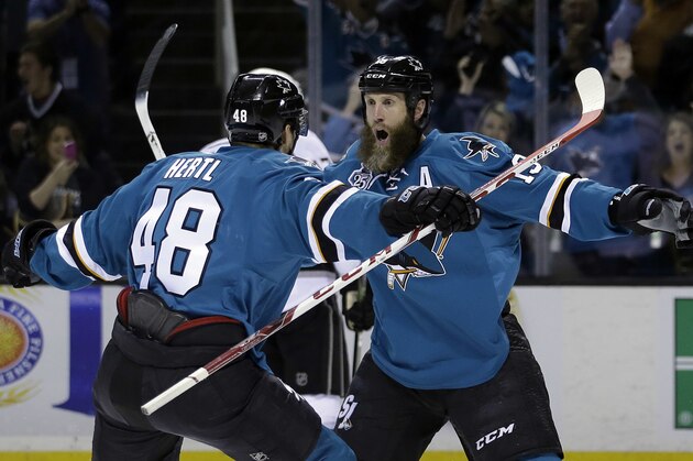 San Jose Sharks' Joe Thornton, right, celebrates his goal with teammate Tomas Hertl (48) during the first period of Game 3 of an NHL hockey first-round Stanley Cup playoff series against the Los Angeles Kings Monday, April 18, 2016, in San Jose, Calif. (AP Photo/Marcio Jose Sanchez)