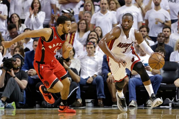 Miami Heat's Dwyane Wade, right, moves the ball past Toronto Raptors' Cory Joseph during the second half of Game 6 of the NBA basketball Eastern Conference semifinals, Friday, May 13, 2016, in Miami. The Heat won 103-91. (AP Photo/Alan Diaz)