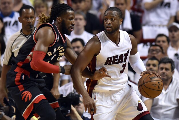 May 7, 2016; Miami, FL, USA; Miami Heat guard Dwyane Wade (3) is pressured by Toronto Raptors forward DeMarre Carroll (5) during the first quarter in game three of the second round of the NBA Playoffs at American Airlines Arena. Mandatory Credit: Steve Mitchell-USA TODAY Sports
