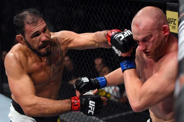 CURITIBA, BRAZIL - MAY 14:  (L-R) Antonio Rogerio Nogueira of Brazil punches Patrick Cummins in their light heavyweight bout during the UFC 198 event at Arena da Baixada stadium on May 14, 2016 in Curitiba, Parana, Brazil.  (Photo by Josh Hedges/Zuffa LLC/Zuffa LLC via Getty Images)