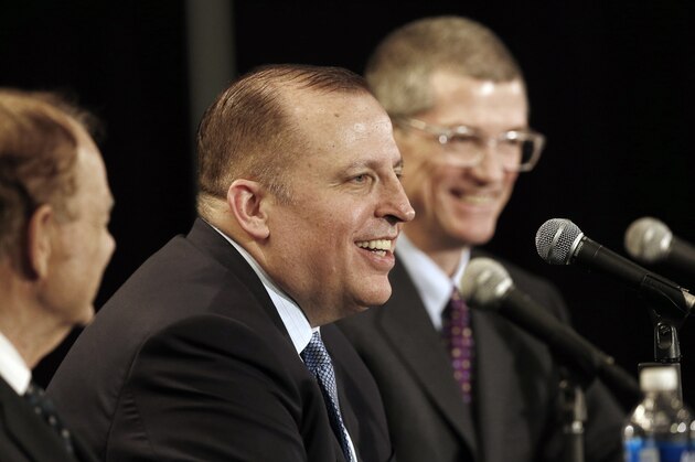 Tom Thibodeau answers a question from the media after he was introduced as the new Minnesota Timberwolves NBA basketball head coach Tuesday, April 26, 2016, in Minneapolis. Listening, left, is Timberwolves owner Glen Taylor, and right, new general manager Scott Layden. (AP Photo/Jim Mone)