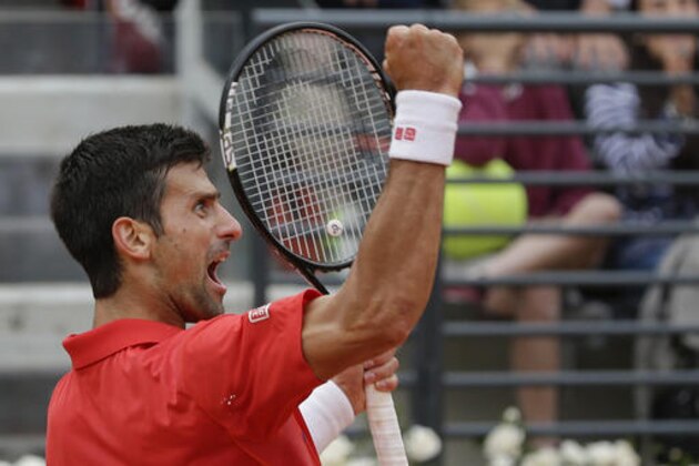 Novak Djokovic, of Serbia, celebrates after winning the first set against Rafael Nadal, of Spain, during their quarter final match at the Italian Open tennis tournament, in Rome, Friday, May 13, 2016. (AP Photo/Alessandra Tarantino)