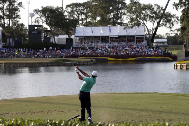 Jason Day of Australia, hits from the 17th tee during the third round of The Players Championship golf tournament Saturday, May 14, 2016, in Ponte Vedra Beach, Fla. (AP Photo/Lynne Sladky)