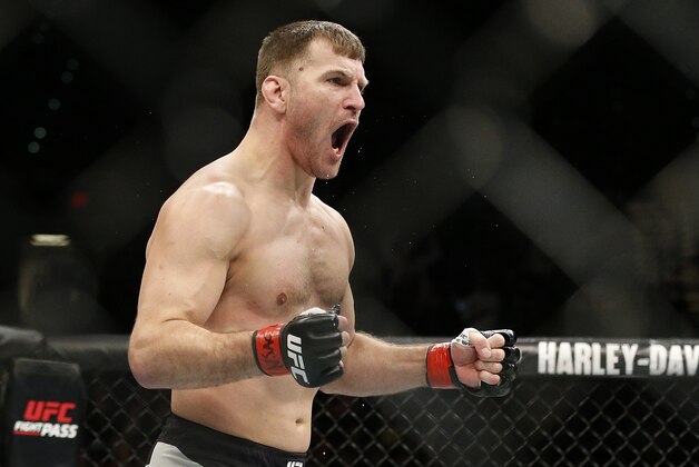 Stipe Miocic celebrates after defeating Andrei Arlovski in a heavyweight mixed martial arts bout at UFC 195, Saturday, Jan. 2, 2016, in Las Vegas. (AP Photo/John Locher)