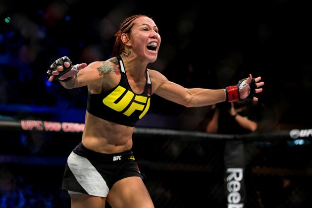 CURITIBA, BRAZIL - MAY 14:  Cris 'Cyborg' Justino of Brazil celebrates after defeating Leslie Smith of the United States in their catchweight bout during the UFC 198 at Arena da Baixada stadium on May 14, 2016 in Curitiba, Brazil. (Photo by Buda Mendes/Zuffa LLC/Zuffa LLC via Getty Images)
