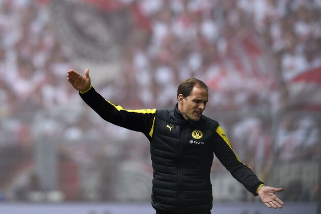 Dortmund's head coach Thomas Tuchel reacts during the German first division Bundesliga football match between Borussia Dortmund  and 1 FC Cologne, in Dortmund, western Germany, on May 14, 2016. / AFP / PATRIK STOLLARZ / RESTRICTIONS: DURING MATCH TIME: DFL RULES TO LIMIT THE ONLINE USAGE TO 15 PICTURES PER MATCH AND FORBID IMAGE SEQUENCES TO SIMULATE VIDEO. == RESTRICTED TO EDITORIAL USE == FOR FURTHER QUERIES PLEASE CONTACT DFL DIRECTLY AT + 49 69 650050
        (Photo credit should read PATRIK STOLLARZ/AFP/Getty Images)