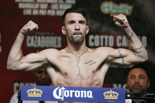 Lee Haskins, of England, poses on the scale during a weigh-in Friday, Nov. 20, 2015, in Las Vegas. Haskins is scheduled to fight Randy Caballero in a IBF bantamweight title fight Saturday in Las Vegas. (AP Photo/John Locher)