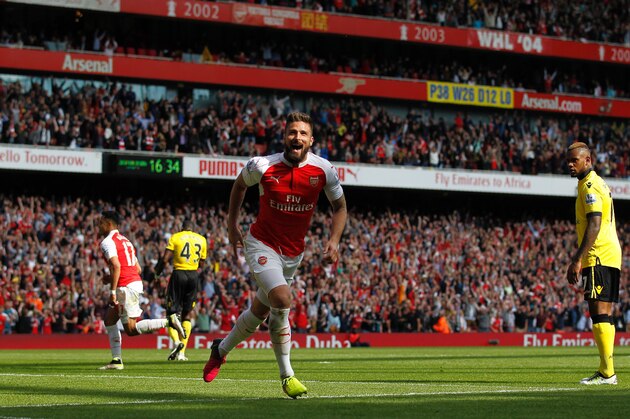 Arsenal's French striker Olivier Giroud (C) celebrates scoring his team's second goal during the English Premier League football match between Arsenal and Aston Villa at the Emirates Stadium in London on May 15, 2016.  / AFP / Ian Kington / RESTRICTED TO EDITORIAL USE. No use with unauthorized audio, video, data, fixture lists, club/league logos or 'live' services. Online in-match use limited to 75 images, no video emulation. No use in betting, games or single club/league/player publications.  /         (Photo credit should read IAN KINGTON/AFP/Getty Images)