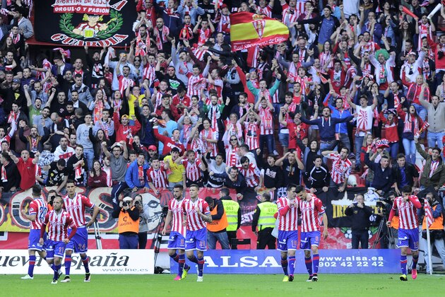 Sporting Gijon's players celebrate a goal during the Spanish league football match Real Sporting de Gijon vs Villarreal CF at the El Molinon stadium in Gijon on May 15, 2016. / AFP / ANDER GILLENEA        (Photo credit should read ANDER GILLENEA/AFP/Getty Images)