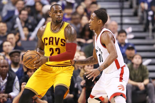 TORONTO, ON - FEBRUARY 26:  LeBron James #23 of the Cleveland Cavaliers gets set to make a pass against DeMar DeRozan #10 of the Toronto Raptors during an NBA game at the Air Canada Centre on February 26, 2016 in Toronto, Ontario, Canada. The Raptors defeated the Cavaliers 99-97. NOTE TO USER: user expressly acknowleges and agrees by downloading and/or using this Photograph, user is consenting to the terms and conditions of the Getty Images License Agreement. (Photo by Claus Andersen/Getty Images)