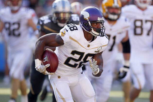 Minnesota Vikings running back Adrian Peterson (28) runs the ball during the NFL Pro Bowl football game, Sunday, Jan. 31, 2016, in Honolulu.  (Jeff Haynes/AP Images for Panini)