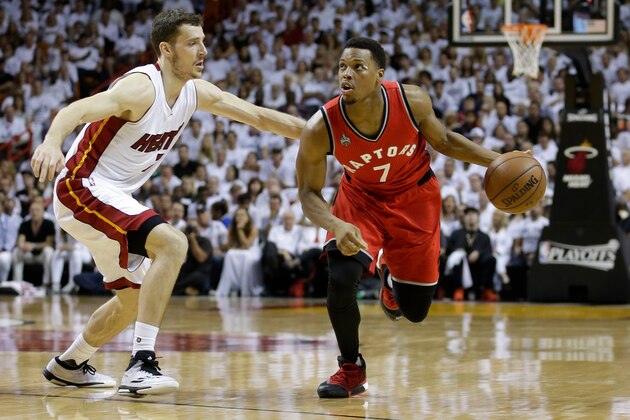 Toronto Raptors' Kyle Lowry, right, drives around Miami Heat's Goran Dragic during the first half of Game 6 of the NBA basketball Eastern Conference semifinals, Friday, May 13, 2016, in Miami. (AP Photo/Alan Diaz)