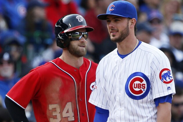 Washington Nationals' Bryce Harper, left, talks with Chicago Cubs third baseman Kris Bryant at third base during the fifth inning of a baseball game Saturday, May 7, 2016, in Chicago. (AP Photo/Nam Y. Huh)