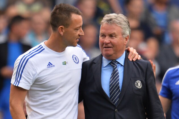 Chelsea's English defender John Terry (L) talks with Chelsea's Dutch interim manager Guus Hiddink after the English Premier League football match between Chelsea and Leicester City at Stamford Bridge in London on May 15, 2016. / AFP / GLYN KIRK / RESTRICTED TO EDITORIAL USE. No use with unauthorized audio, video, data, fixture lists, club/league logos or 'live' services. Online in-match use limited to 75 images, no video emulation. No use in betting, games or single club/league/player publications.  /         (Photo credit should read GLYN KIRK/AFP/Getty Images)