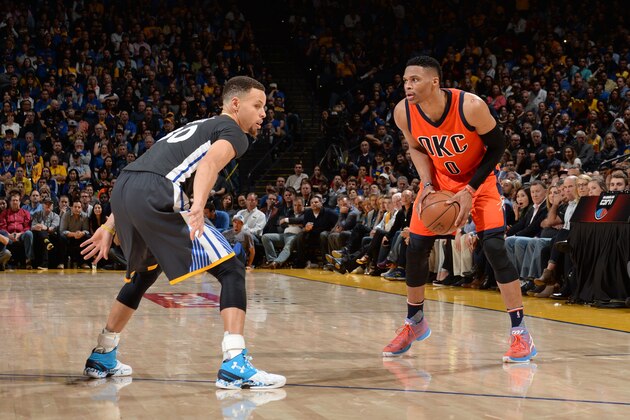 OAKLAND, CA - FEBRUARY 6: Russell Westbrook #0 of the Oklahoma City Thunder defends the ball against Stephen Curry #30 of the Golden State Warriors during the game on February 6, 2016 at ORACLE Arena in Oakland, California. NOTE TO USER: User expressly acknowledges and agrees that, by downloading and or using this Photograph, user is consenting to the terms and conditions of the Getty Images License Agreement. Mandatory Copyright Notice: Copyright 2016 NBAE (Photo by Noah Graham/NBAE via Getty Images)