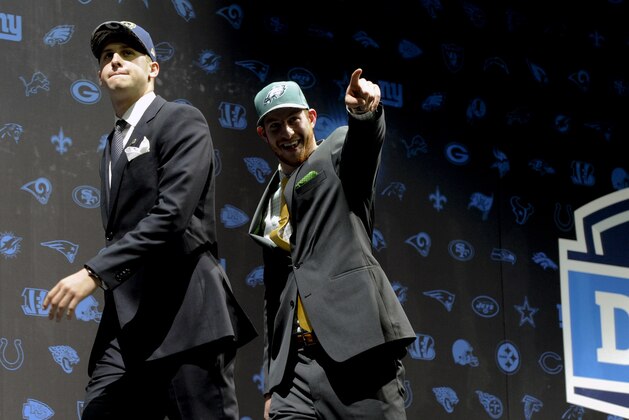 Jared Goff, left, after being selected by Los Angeles Rams as their number one overall pick and Carson Wentz, after being selected by the Philadelphia Eagles as their top pick in the first round of the 2016 NFL football draft greet fans at Selection Square in Grant Park, Thursday, April 28, 2016, in Chicago. (AP Photo/Matt Marton)