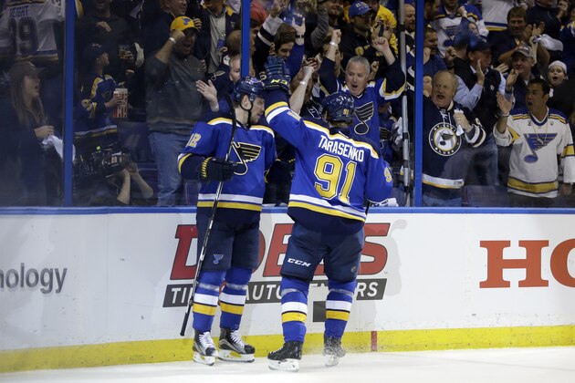 St. Louis Blues center Jori Lehtera (12) celebrates with right wing Vladimir Tarasenko (91) after scoring a goal during the second period in Game 1 of the NHL hockey Stanley Cup Western Conference finals against the San Jose Sharks, Sunday, May 15, 2016, in St. Louis. (AP Photo/Jeff Roberson)
