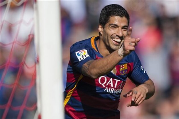 FC Barcelona's Luis Alberto Suarez from Uruguay celebrates after scoring his third goal against Granada during a Spanish La Liga soccer match between Granada and Barcelona at Los Carmenes stadium in Granada, Spain, Saturday, May 14, 2016. (AP Photo/Daniel Tejedor)