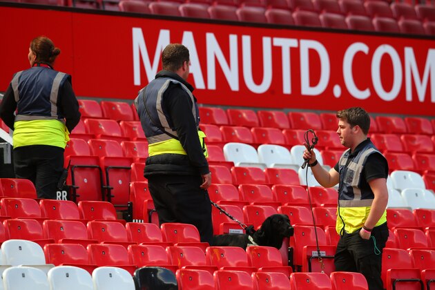 MANCHESTER, ENGLAND - MAY 15:  A sniffer dog patrols the stands as the match is abandoned with fans evacuated from the ground prior to the Barclays Premier League match between Manchester United and AFC Bournemouth at Old Trafford on May 15, 2016 in Manchester, England.  (Photo by Alex Livesey/Getty Images)