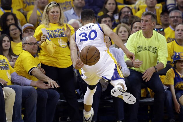 Golden State Warriors' Stephen Curry (30) saves the ball from going out of bounds during the first half in Game 5 of a second-round NBA basketball playoff series against the Portland Trail Blazers on Wednesday, May 11, 2016, in Oakland, Calif. (AP Photo/Marcio Jose Sanchez)