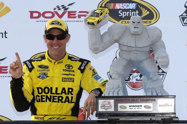 DOVER, DE - MAY 15:  Matt Kenseth, driver of the #20 Dollar General Toyota, poses with the trophy in Victory Lane after winning the NASCAR Sprint Cup Series AAA 400 Drive for Autism at Dover International Speedway on May 15, 2016 in Dover, Delaware.  (Photo by Matt Hazlett/Getty Images)