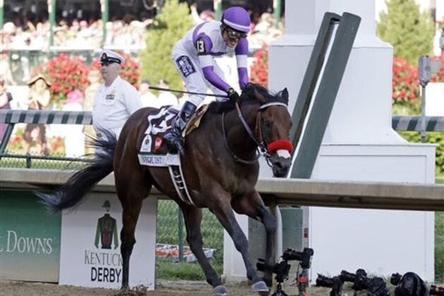 CORRECTS LAST NAME TO GUTIERREZ FROM GUITIERREZ - Mario Gutierrez celebrates after riding Nyquist to victory during the 142nd running of the Kentucky Derby horse race at Churchill Downs Saturday, May 7, 2016, in Louisville, Ky. (AP Photo/Garry Jones)