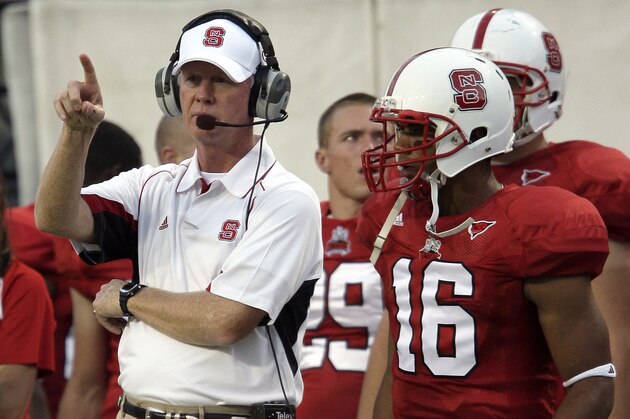 North Carolina State coach Tom O'Brien and quarterback Russell Wilson (16) watch from the sidelines during the first half of an NCAA college football game against Murray State Saturday, Sept. 12, 2009 in Raleigh, N.C. North Carolina State won 65-7. (AP Photo/Gerry Broome)